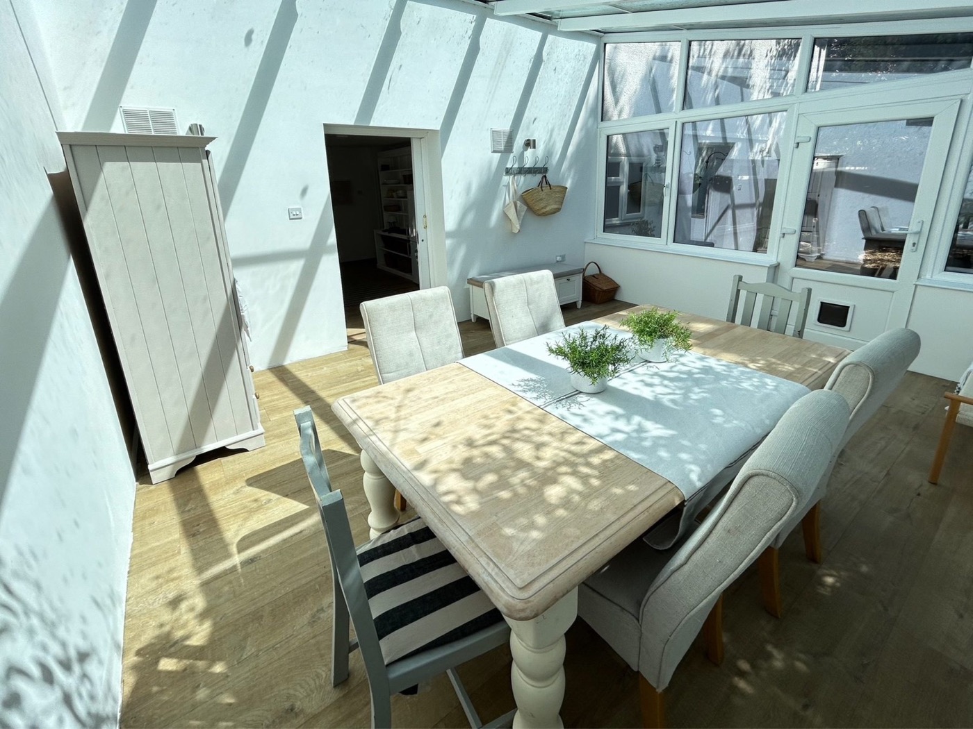Dining table in the bright conservatory